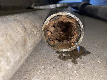 View of inside of old galvanized iron water pipe, image courtesy of Chicago Plumbing's Facebook page