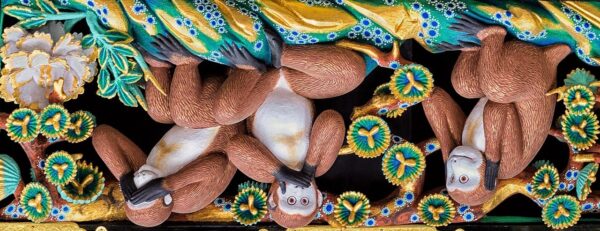 Upside-down image of the three wise monkeys at the Tosho-gu shrine in Japan.  They illustrate the Buddhist saying "hear no evil, see no evil, and speak no evil."
