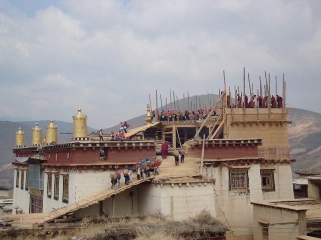 Everyone gets involved with rebuilding of Tibetan monastery.