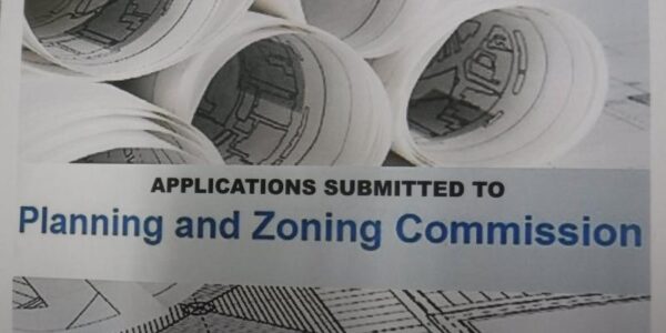 Pictured are rolled street plans with the words "Applications submitted to Planning and Zoning Commission" in a boxed insert.