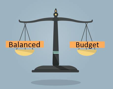 A depiction of a weighing scale with the words "balanced" and "budget" imposed over each of the weighing plates