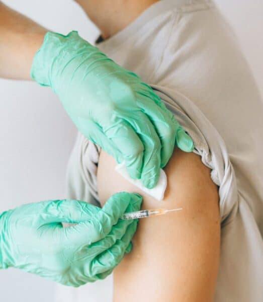 Person receiving COVID vaccination