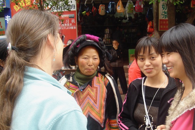 Author chatting with 3 women.