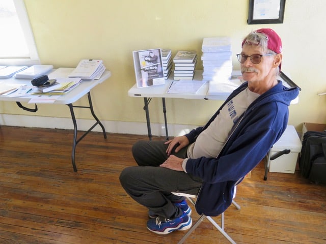 Gibson seated in bookstore