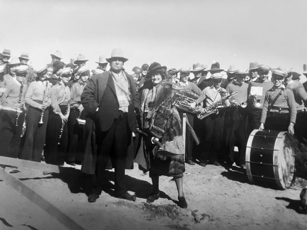 Gov. Clyde Tingley and his wife Carrie came at the groundbreaking on February 13, 1936. A marching band is behind them,.