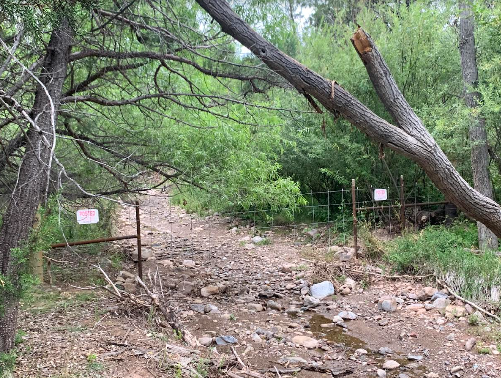 Percha Creek with fence across it