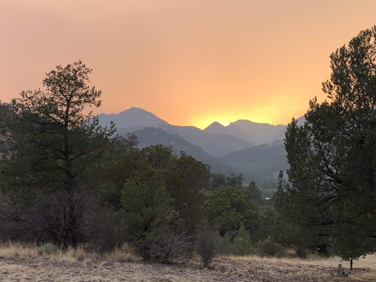 Bright sun peaking behind smoke
