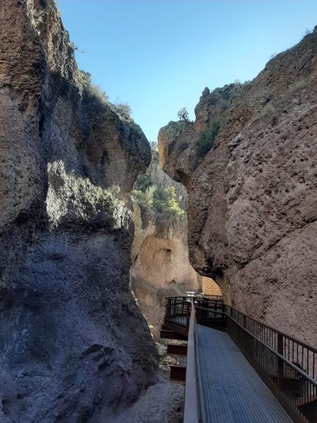 Where the canyon walls almost meet overhead, the Catwalk passes quietly beneath
