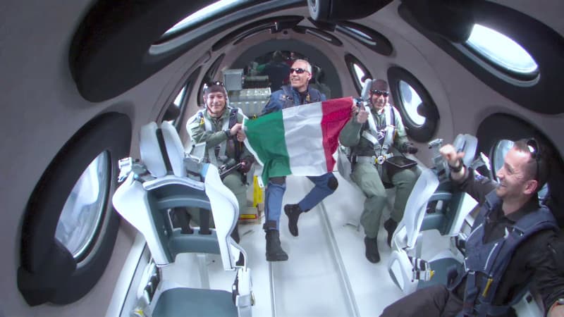 Italian research crew celebrating aboard the Unity spaceship