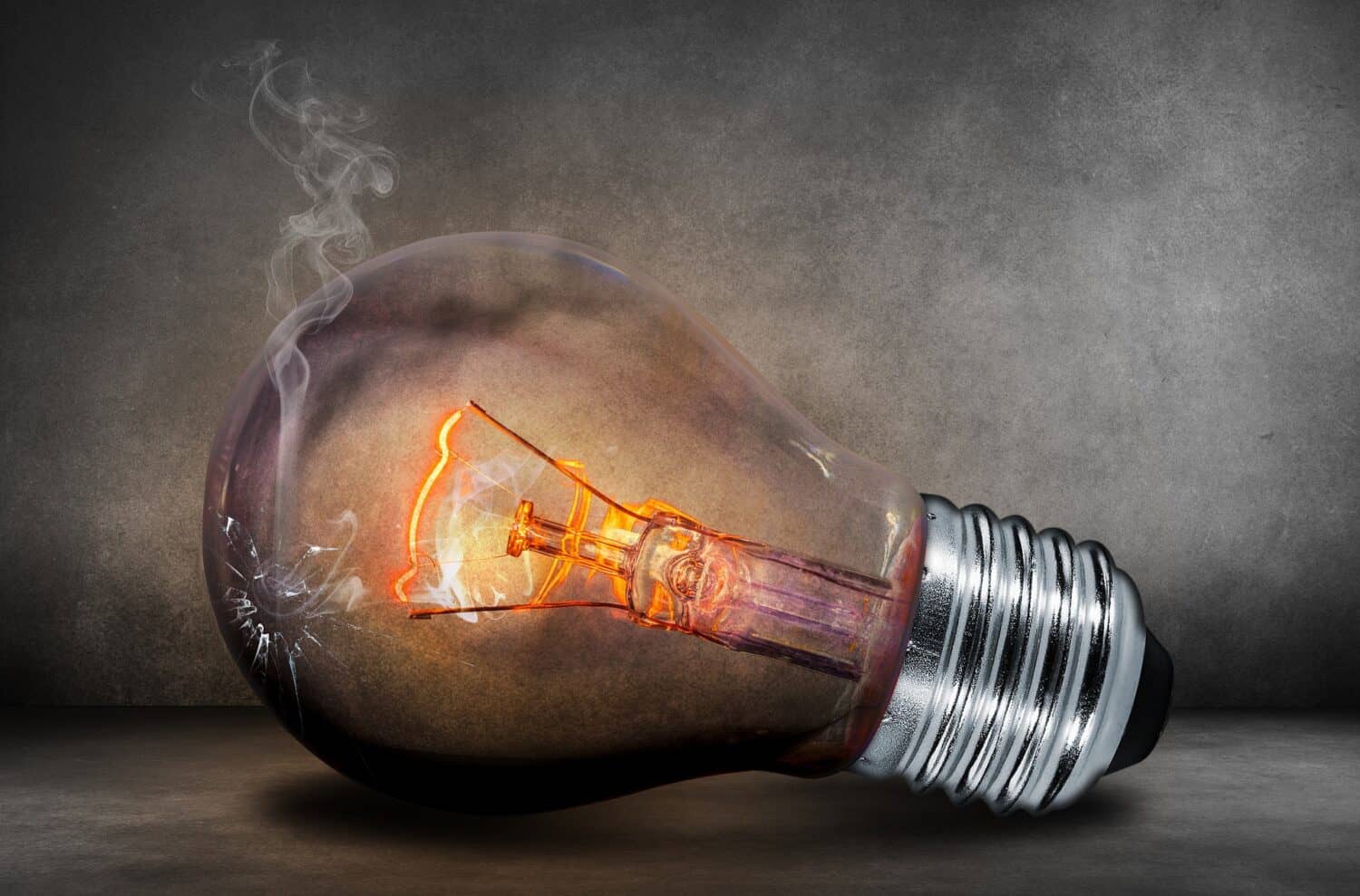 Light bulb with steam coming out of it.