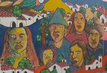 mural depicting the faces of migrants seeking U.S. asylum