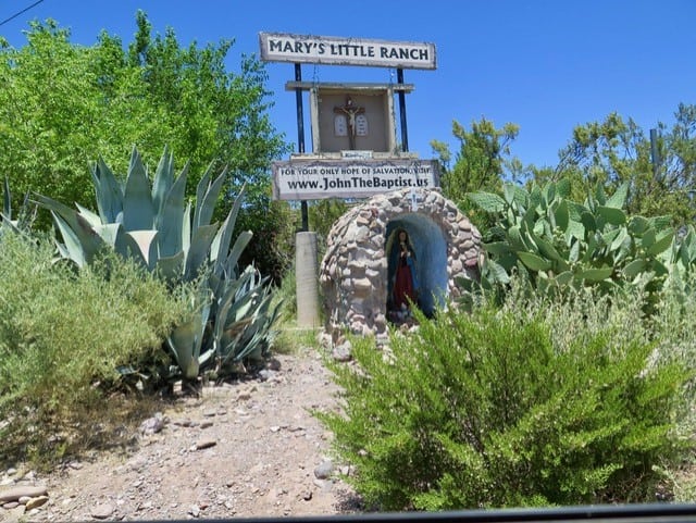 Entrance to Mary's Little Ranch is marked by a shrine and an ad for the Remnant's website